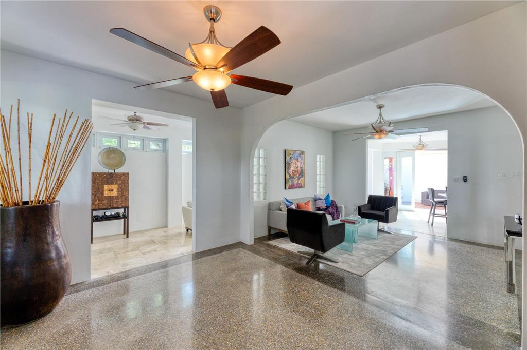 A living room features two black armchairs, a gray sofa, and a glass coffee table — 3 PACIFIC PLACE STREET, SAN JUAN, PR