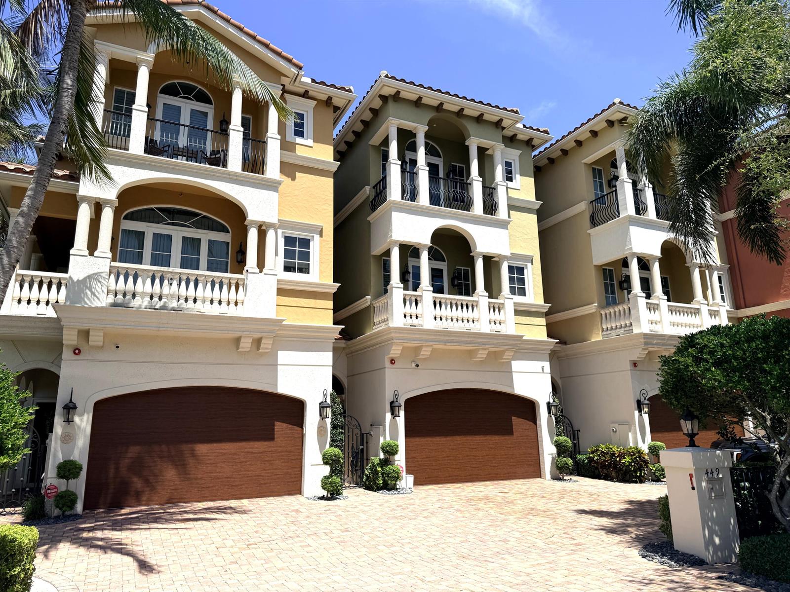 A covered patio features a seating area, barrel-style bar, and views of a waterway — 449 NE 19th Avenue, Deerfield Beach FL 33441, DEERFIELD BEACH, FL