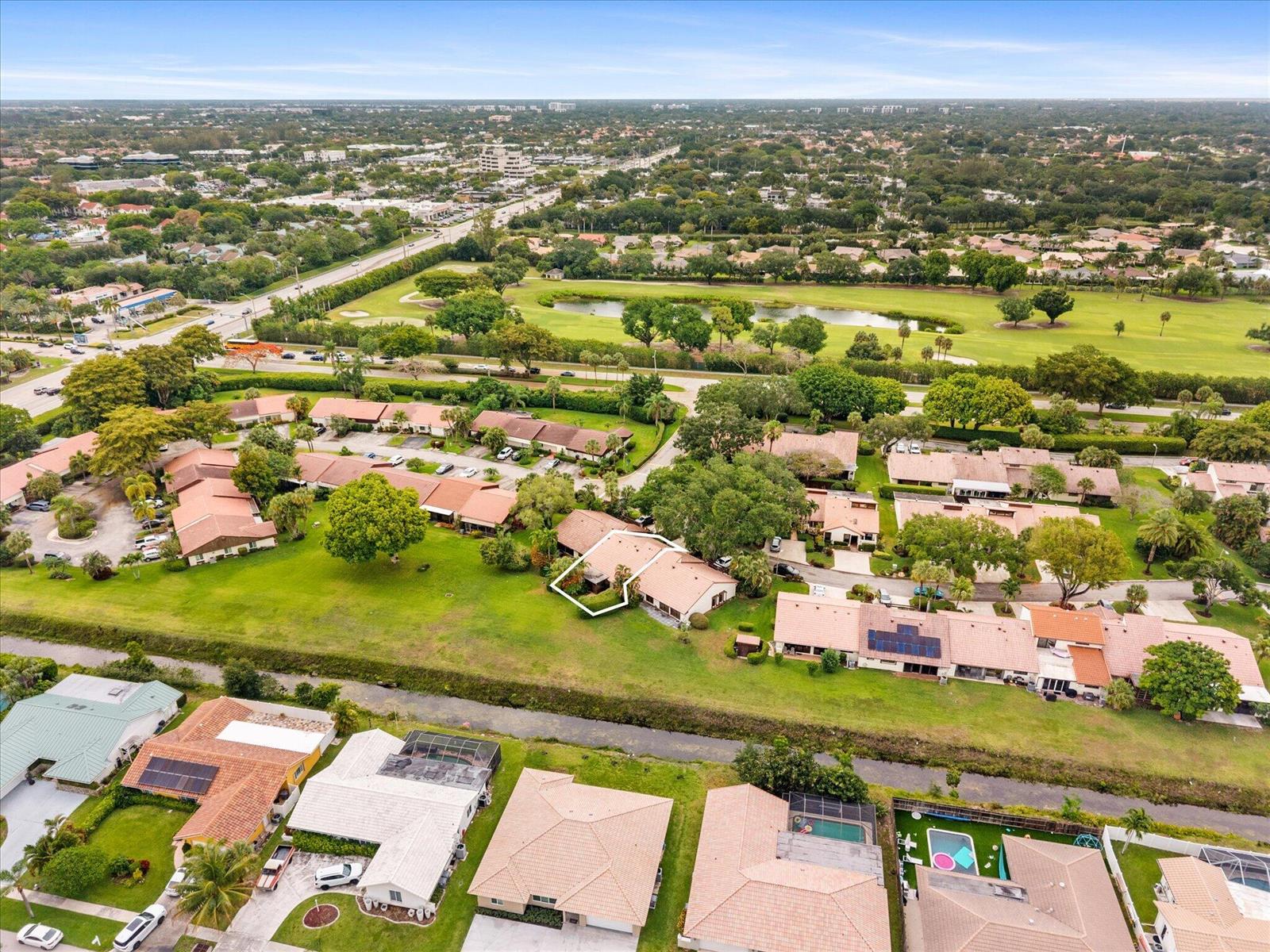 An aerial view shows a residential neighborhood with a highlighted single-story house and golf course — 6886 Tiburon Circle, Boca Raton FL 33433, BOCA RATON, FL