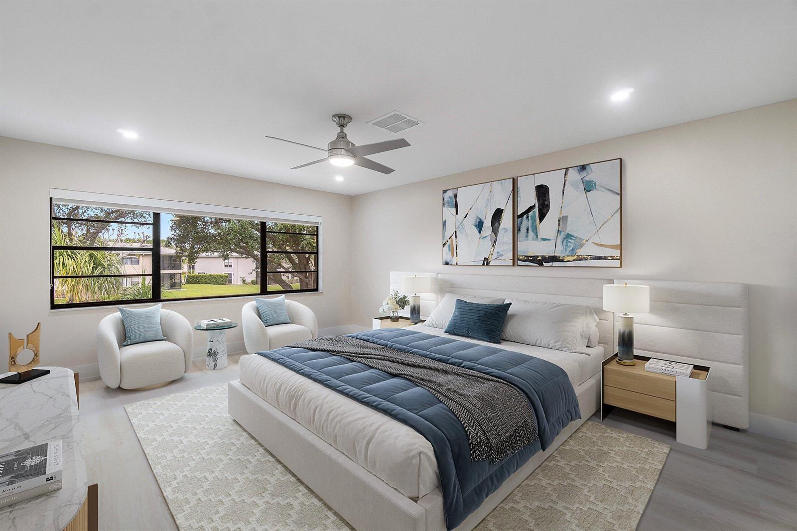 A modern kitchen features white cabinets, stainless steel appliances, and white countertops — 16 Stratford Drive E # C, Boynton Beach FL 33436, BOYNTON BEACH, FL