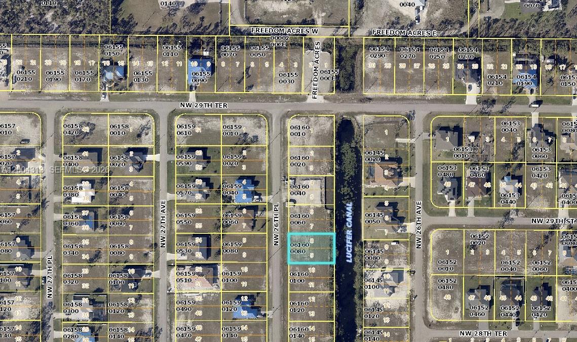 This is an aerial map showing residential lots, streets, and a canal — 2831 NW 26th pl, Cape Coral FL 33993, CAPE CORAL, FL