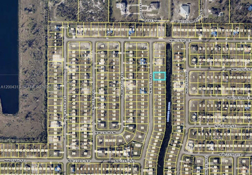 This is an aerial map showing residential lots and streets in a suburban neighborhood — 2831 NW 26th pl, Cape Coral FL 33993, CAPE CORAL, FL