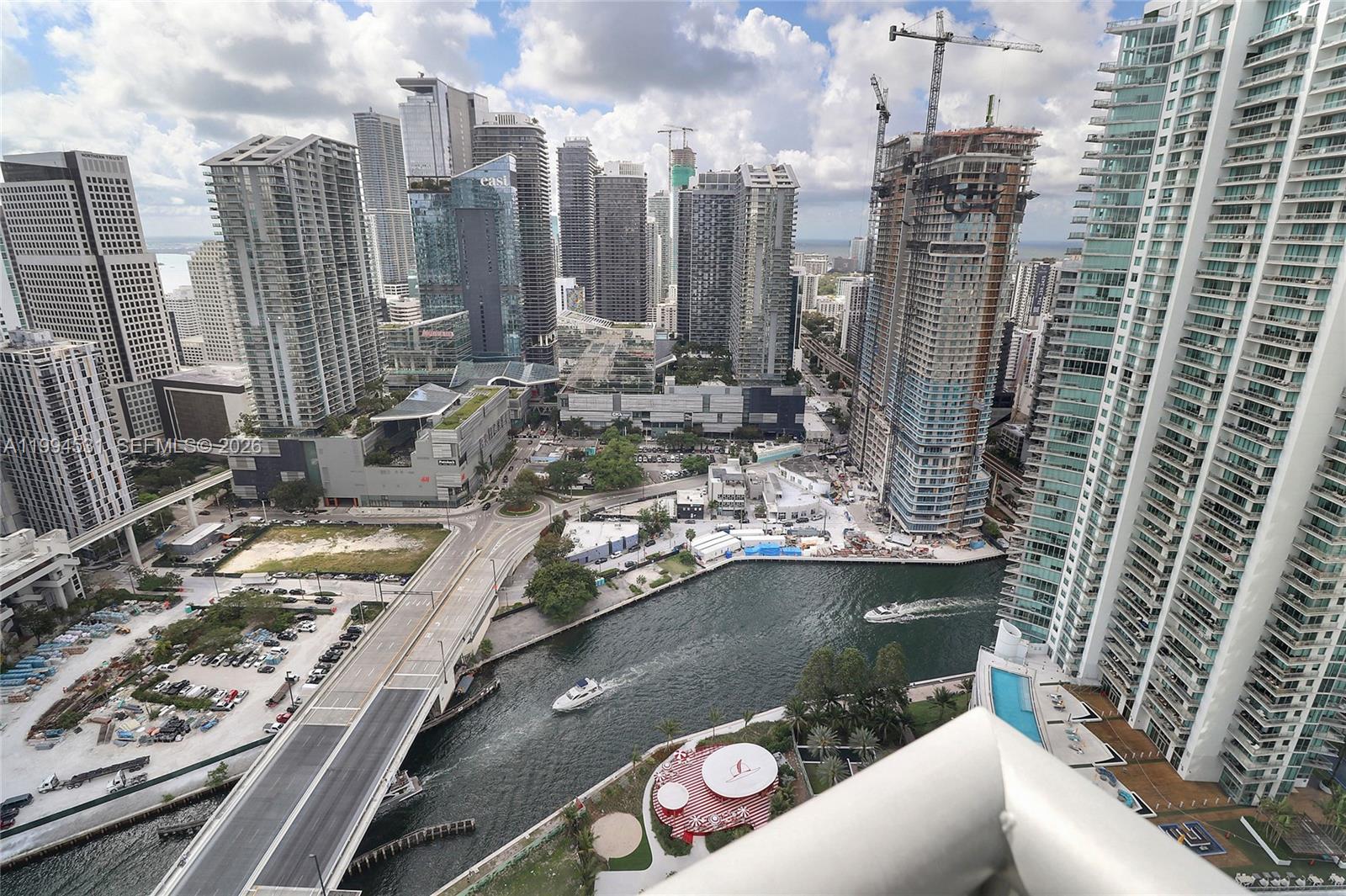 An elevated view of a city skyline with skyscrapers, a river, and a bridge — 350 S Miami Ave # 4110, Miami FL 33130, MIAMI, FL
