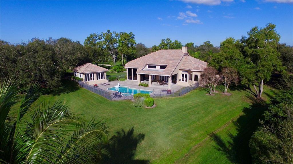 An aerial view of a house with a swimming pool and a detached garage — 3190 Willow Lane, Weston FL 33331, WESTON, FL