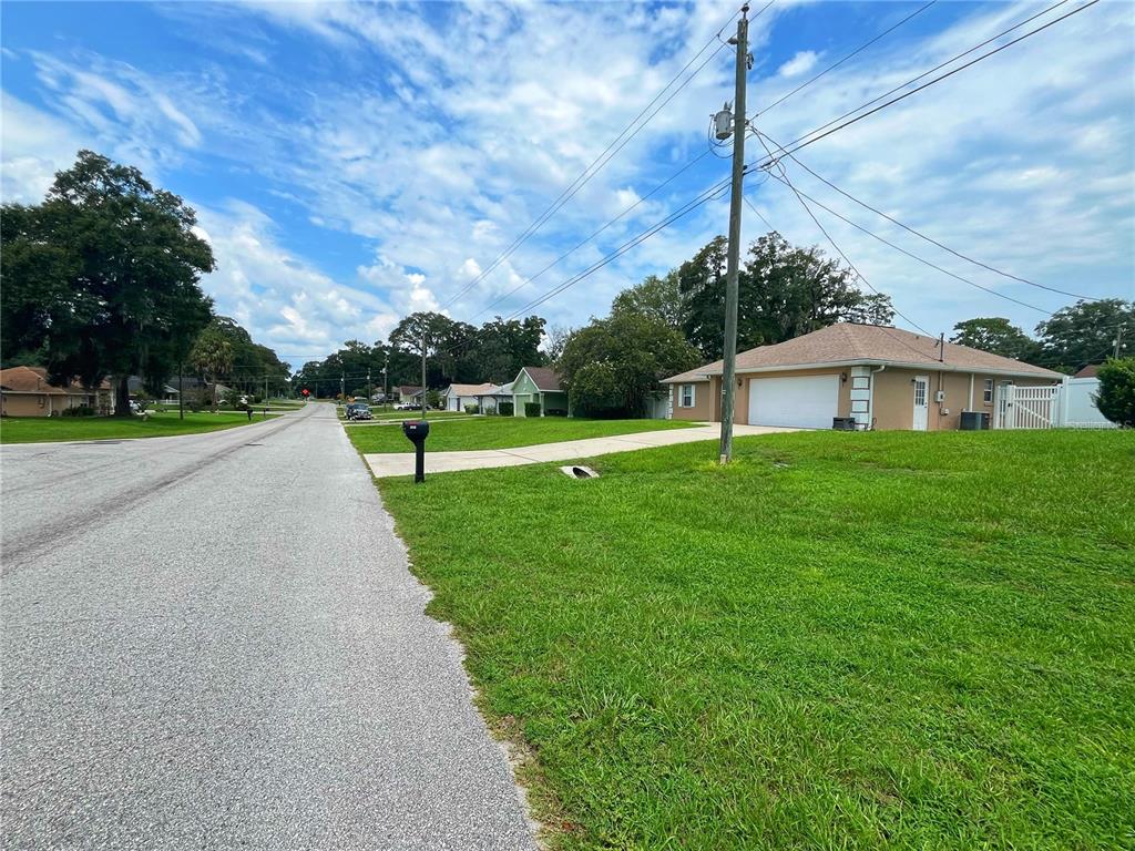 A street view shows a single-story house with a white garage door and green lawn — 3201 NE 42ND PLACE, OCALA, FL