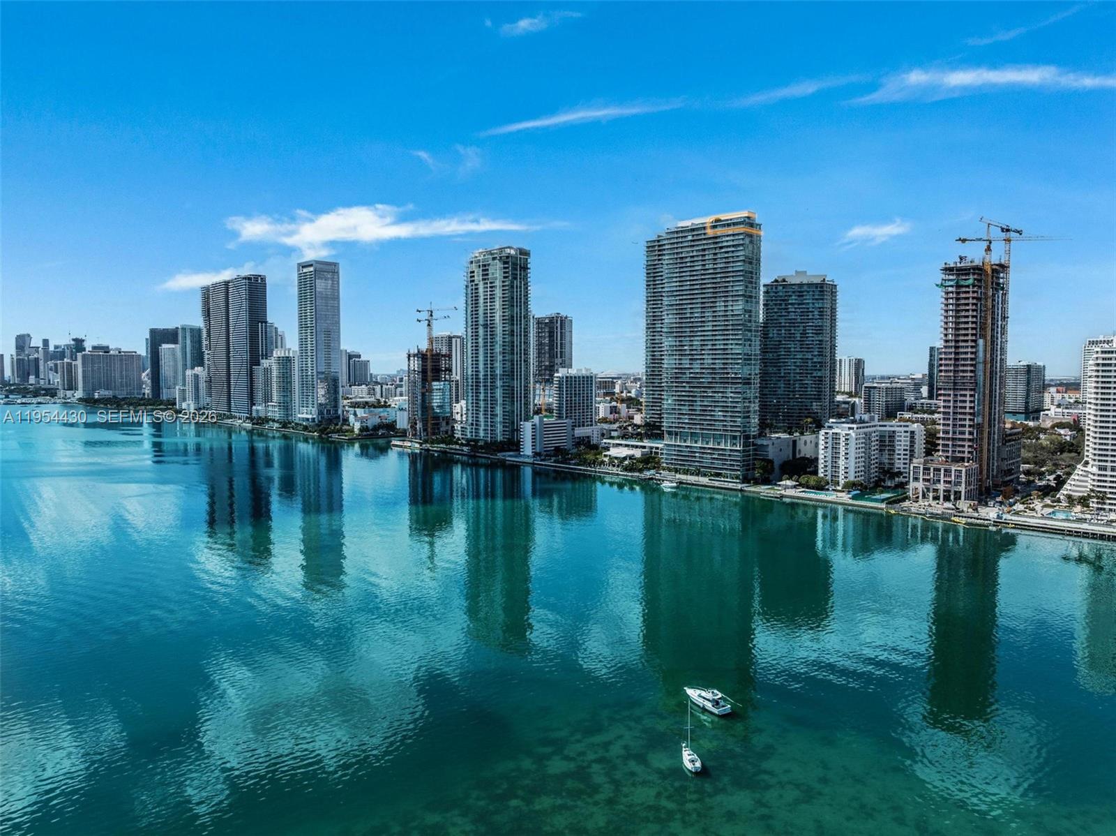 An aerial view of the Miami skyline featuring high-rise buildings along the waterfront — 3131 NE 7th Ave, Miami FL 33137, MIAMI, FL