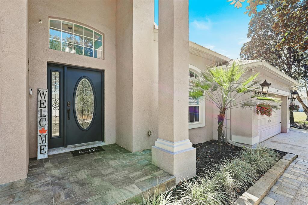 An entryway with a blue front door, tile flooring, and French doors leading to a room — 12114 CREEK EDGE DRIVE, RIVERVIEW, FL