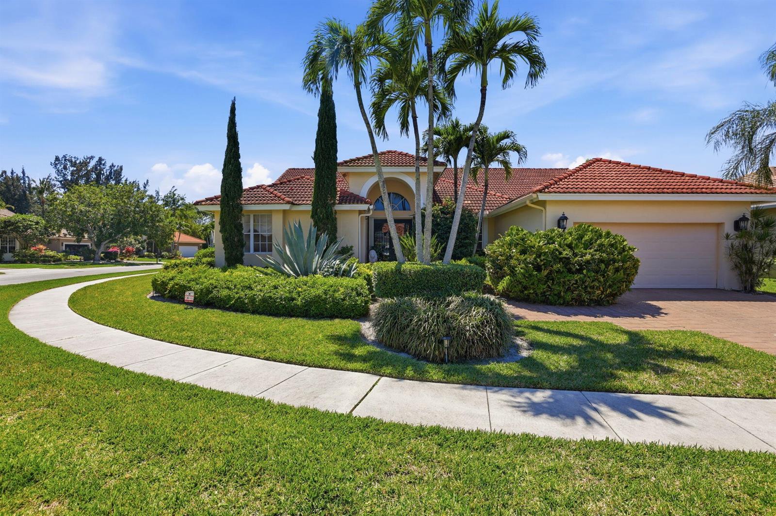 A single-story house with a red tile roof, palm trees, and a paved driveway — 7821 Dorchester Road, Boynton Beach FL 33472, BOYNTON BEACH, FL