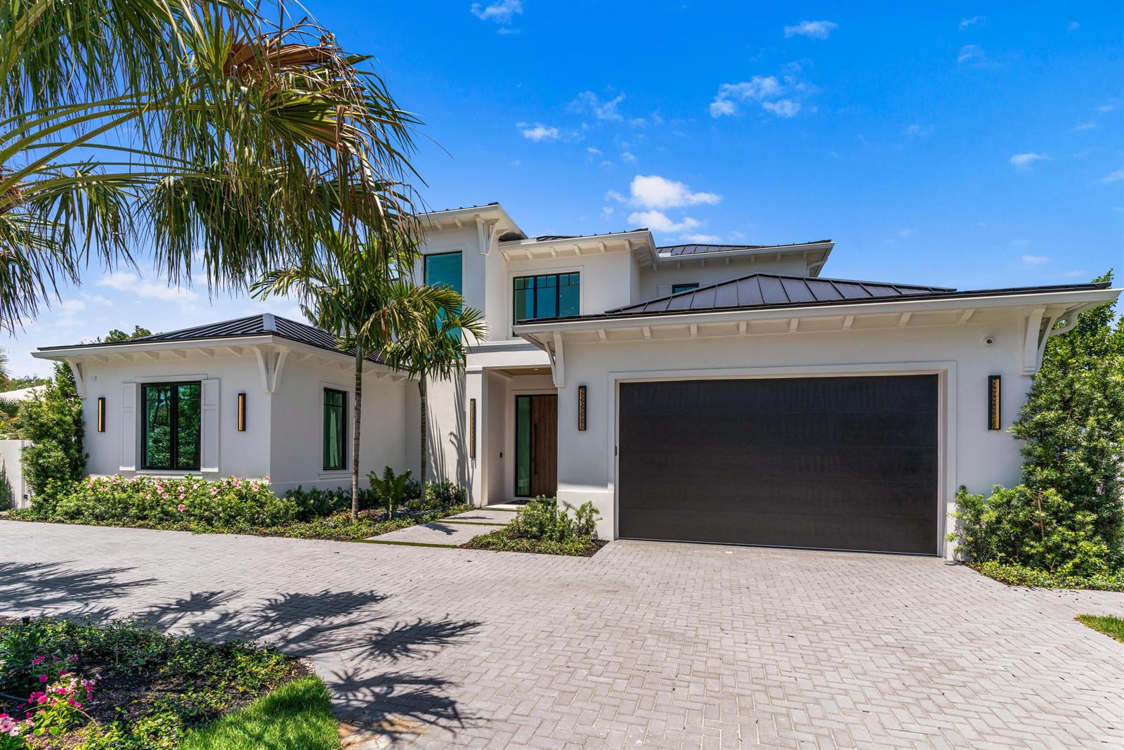 A two-story white house with a dark metal roof and a large paved driveway — 720 NW 3rd Avenue, Delray Beach FL 33444, DELRAY BEACH, FL