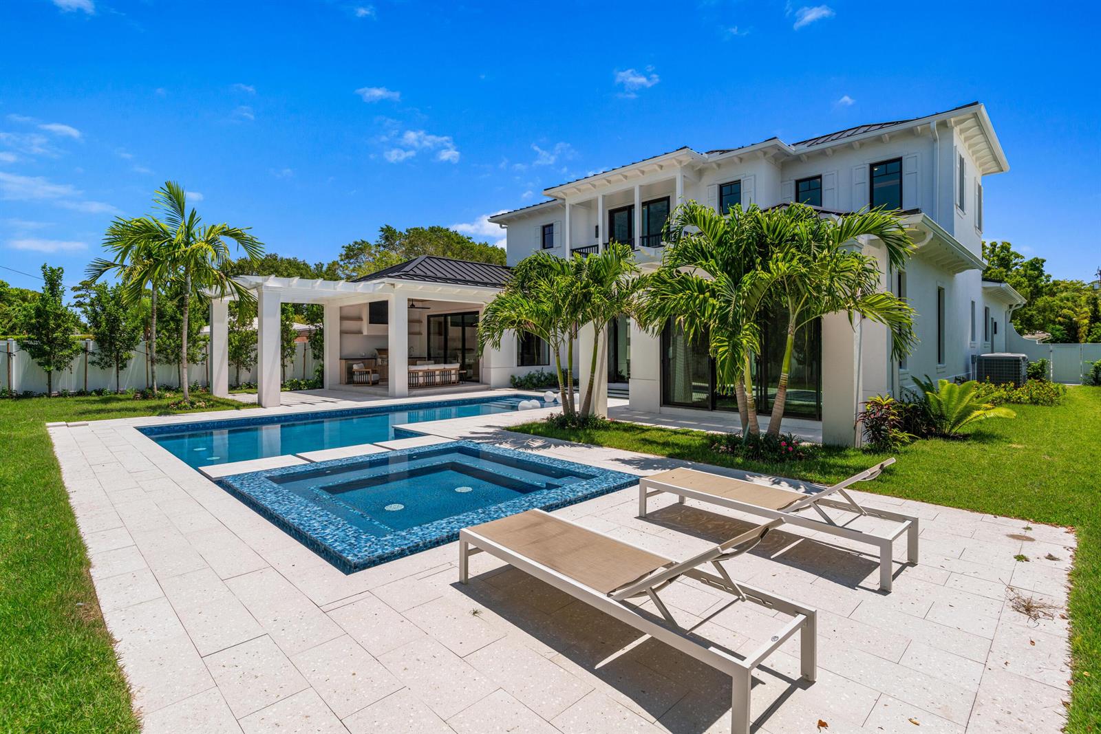 A two-story white house features a swimming pool, spa, and covered patio in the backyard — 720 NW 3rd Avenue, Delray Beach FL 33444, DELRAY BEACH, FL