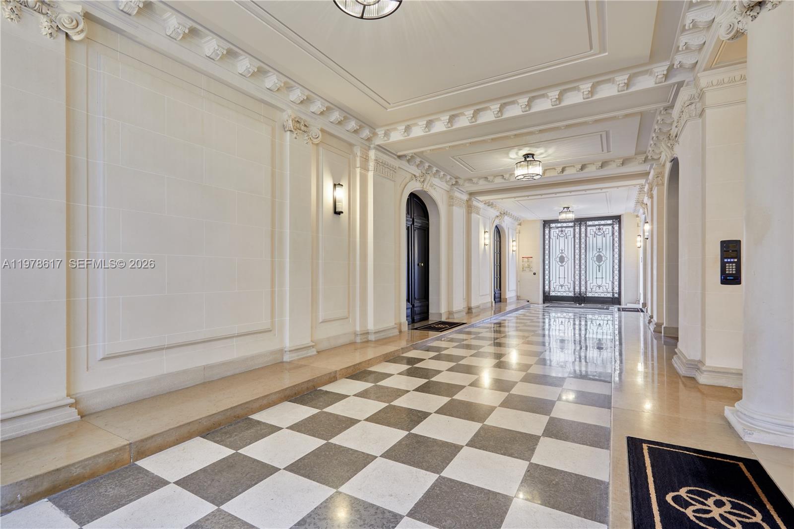 A grand hallway features a black and white checkered floor, ornate crown molding, and columns — 11 RUE ST DOMINIQUE, FR, FR