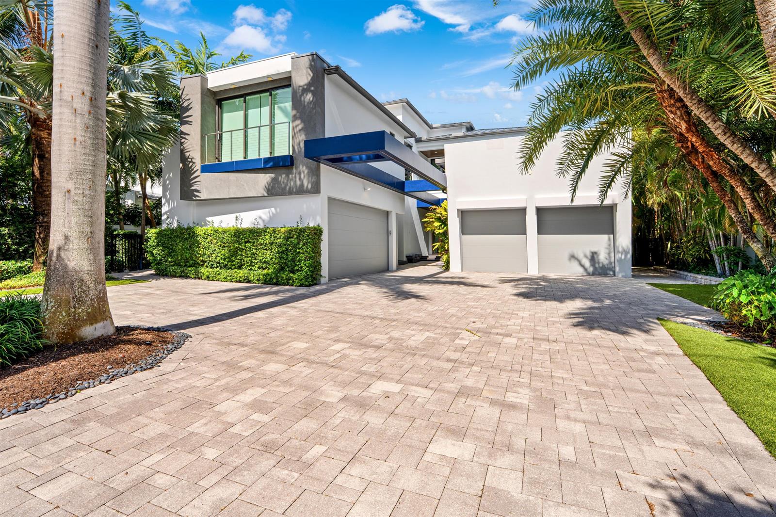 A modern two-story house with a three-car garage and a paved driveway — 1040 S Ocean Boulevard, Delray Beach FL 33483, DELRAY BEACH, FL