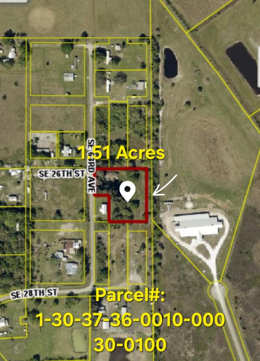This is an aerial map showing a highlighted land parcel with a pin marker — 2630 SE 63rd Avenue, Okeechobee FL 34974, OKEECHOBEE, FL
