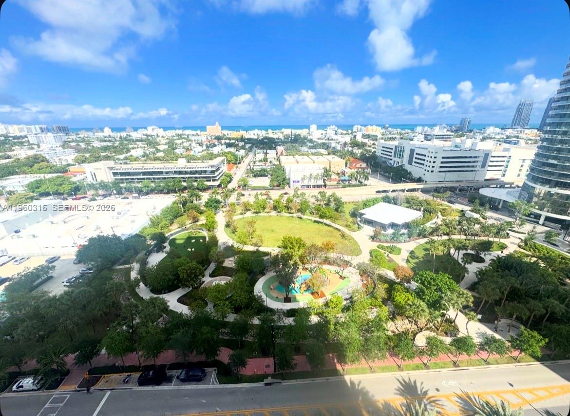 An elevated view of a public park with walking paths, trees, and a playground — 650 West Ave # 1704, Miami Beach FL 33139, MIAMI BEACH, FL