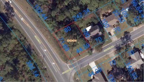 This is an aerial map showing a vacant residential lot outlined in red — 7600 OLD HICKORY DRIVE, PENSACOLA, FL