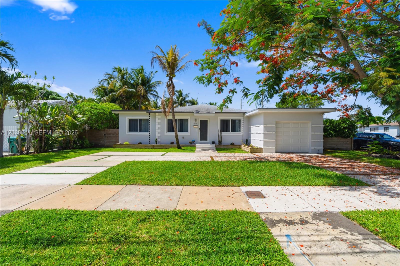A single-story house with a white exterior, a garage, and a front lawn with pavers — 5790 SW 3rd St, Miami FL 33144, MIAMI, FL