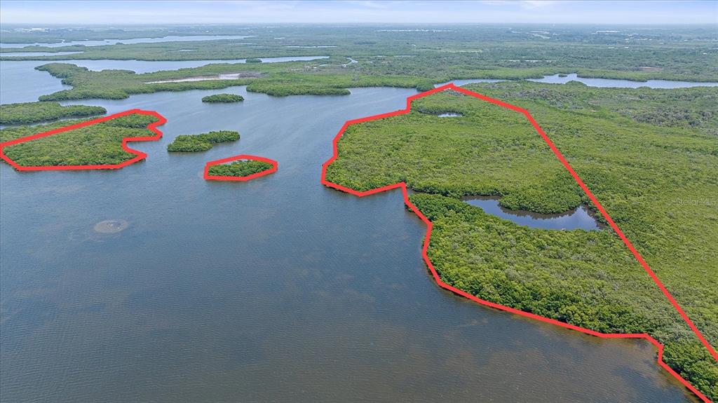 An aerial view shows several mangrove islands outlined in red surrounded by open water — STOTZ ROAD, PALMETTO, FL