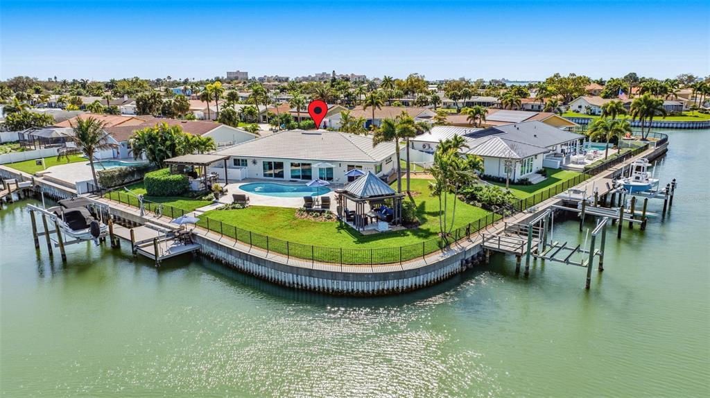 An aerial view of a waterfront house with a pool, gazebo, and private boat dock — 4310 40TH STREET S, ST PETERSBURG, FL