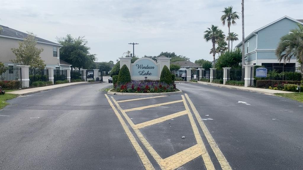 The entrance to the Windsor Lake community features a gated road and landscaped signage — 1131 TRILLIUM PARK LANE, SANFORD, FL