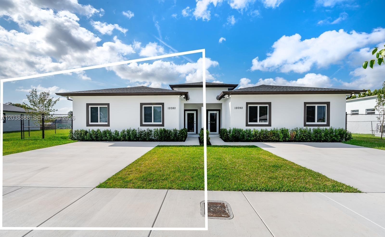 A modern duplex with white stucco walls, dark trim, and two separate front entrances — 12080 & 12090 SW 213th St, Miami FL 33177, MIAMI, FL