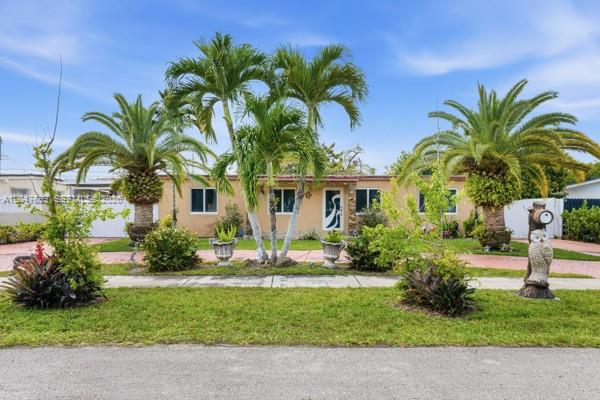 A single-story house with palm trees, a front lawn, and an owl statue — 5000 SW 98th Ave Rd # 0, Miami FL 33165, MIAMI, FL
