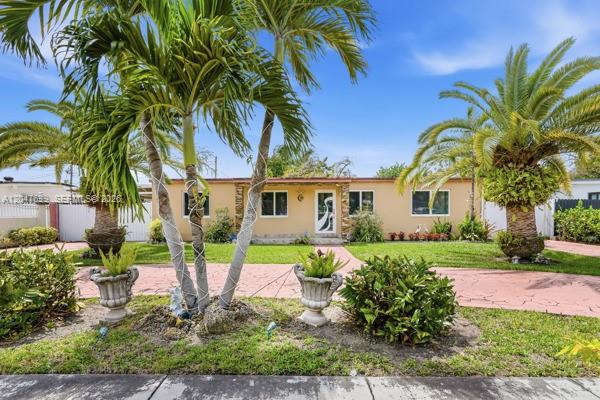 A single-story house with a tan exterior, palm trees, and a paved driveway — 5000 SW 98th Ave Rd # 0, Miami FL 33165, MIAMI, FL