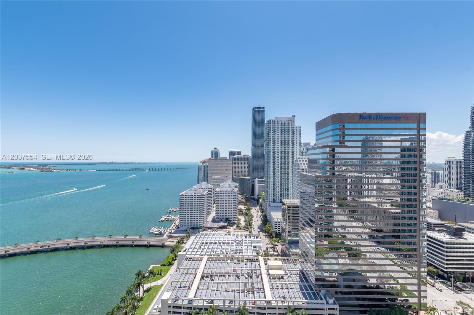 An elevated view of the Miami skyline, waterfront, and a large parking structure — 475 Brickell Ave # 2908, Miami FL 33131, MIAMI, FL