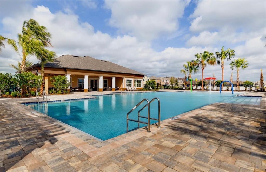 A kitchen with gray cabinets, granite countertops, stainless steel appliances, and a central island — 2651 GRANDBURY GROVE ROAD, LAKELAND, FL