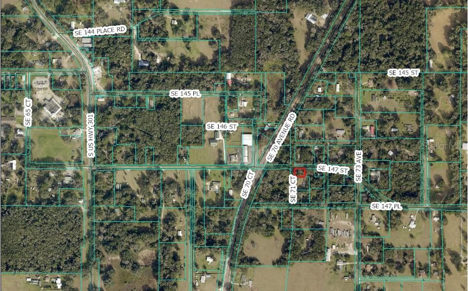 An aerial map view shows a residential property highlighted in red among surrounding land parcels — TBD SE 147TH STREET, SUMMERFIELD, FL