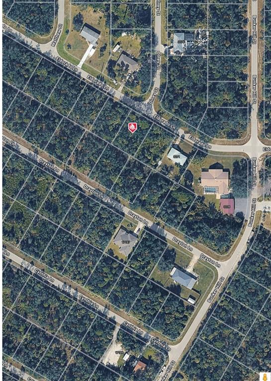 This is an aerial map view showing a vacant residential lot marked with a red pin — 3255 ELDORADO LANE, PORT CHARLOTTE, FL