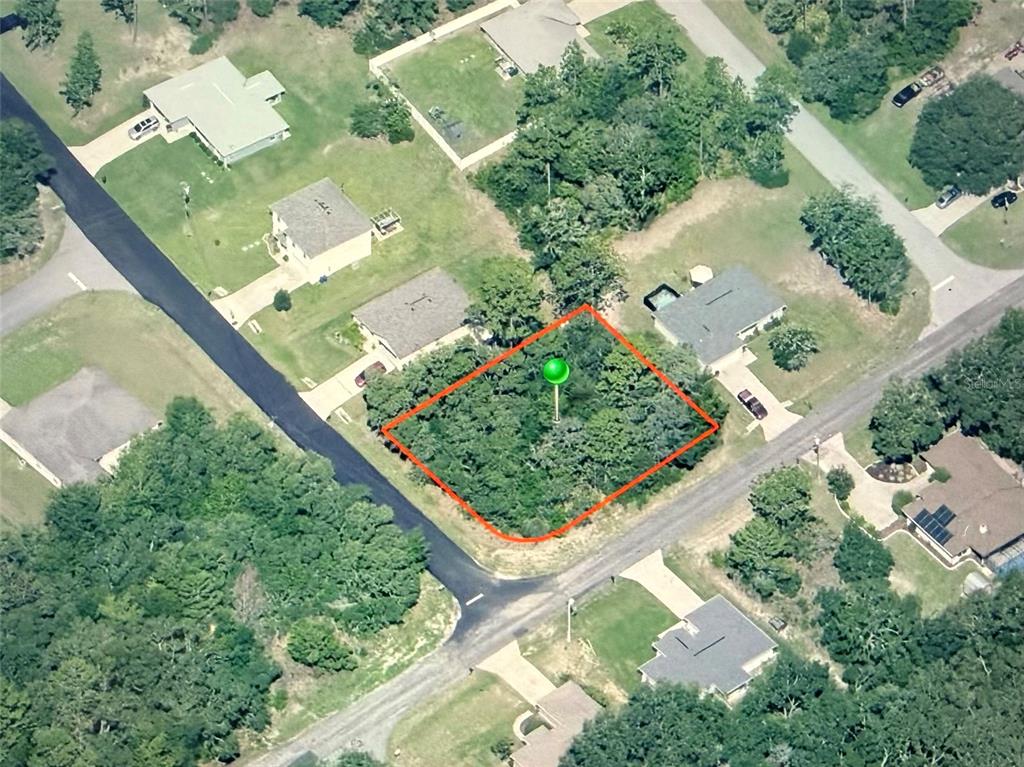 An aerial view shows a vacant, wooded residential lot outlined in red — 3115 W BABCOCK PLACE, CITRUS SPRINGS, FL