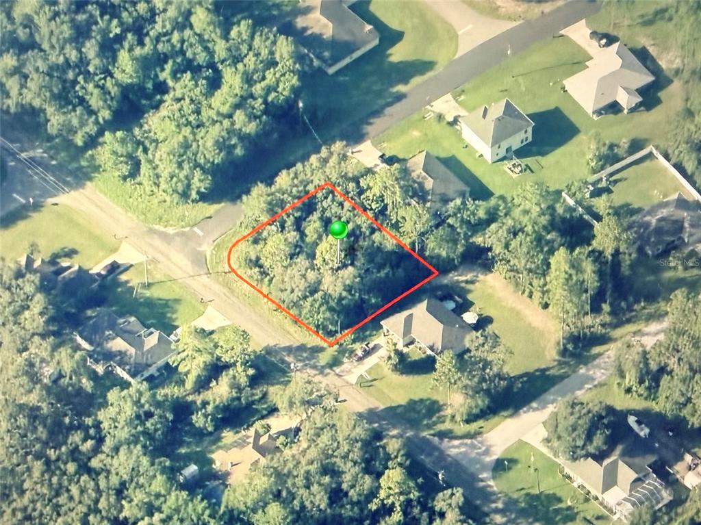 An aerial view shows a vacant, wooded residential lot outlined in red — 3115 W BABCOCK PLACE, CITRUS SPRINGS, FL