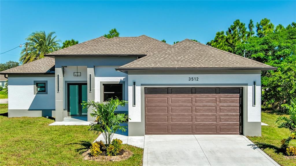 A single-story house with a brown garage door, white stucco walls, and a shingled roof — 3512 9TH STREET W, LEHIGH ACRES, FL