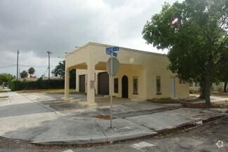 A single-story, light-yellow commercial building with a covered entrance sits on a corner lot — 3712 S Olive Ave, West Palm Beach FL 33405, WEST PALM BEACH, FL