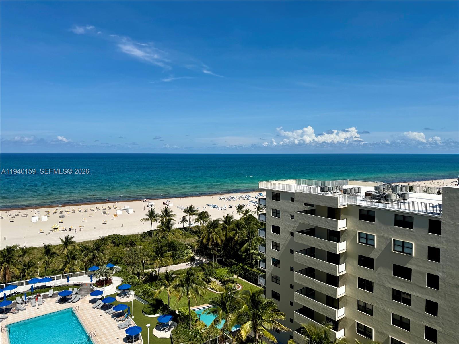 An elevated view of a beach, ocean, swimming pool, and a multi-story apartment building — 100 Lincoln Rd # 1230, Miami Beach FL 33139, MIAMI BEACH, FL