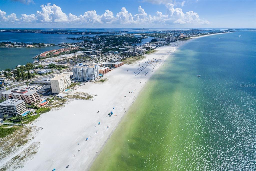 An aerial view of a sandy beach lined with hotels and condominiums along the coast — 6161 GULF WINDS DRIVE UNIT 338, ST PETE BEACH, FL