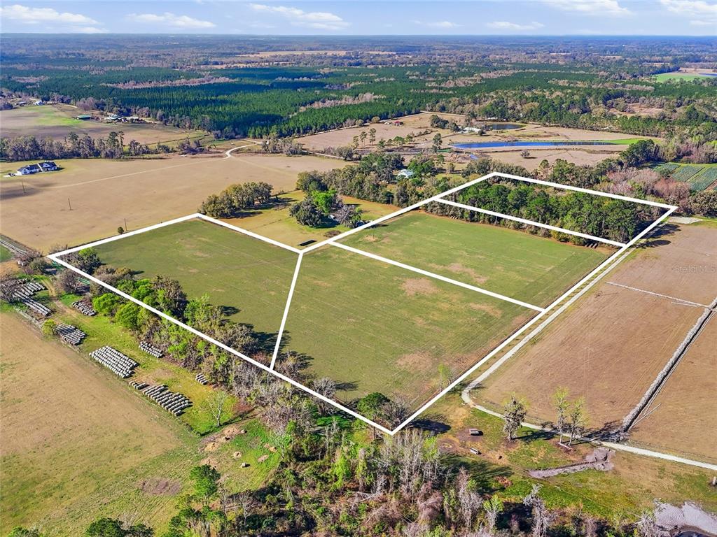 An aerial view shows several large, open grassy lots outlined in white on rural land — TBD NW COUNTY ROAD 239, ALACHUA, FL