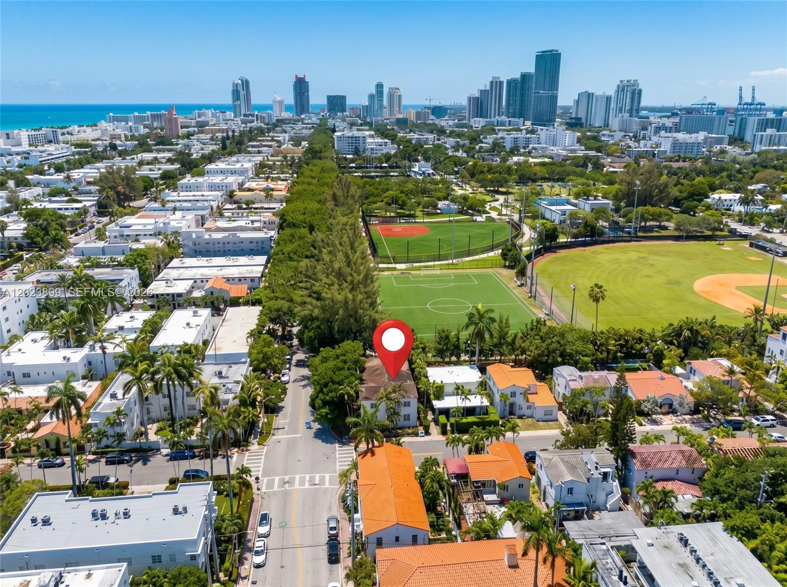An aerial view shows a residential neighborhood with a red-roofed house marked by a pin — 1438 Meridian Ave, Miami Beach FL 33139, MIAMI BEACH, FL