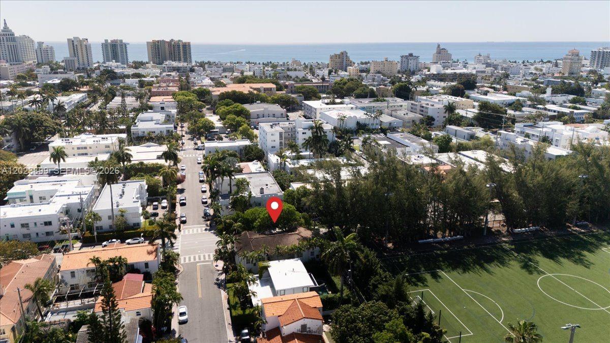 An aerial view shows a residential neighborhood with a red location pin over a house — 1438 Meridian Ave, Miami Beach FL 33139, MIAMI BEACH, FL