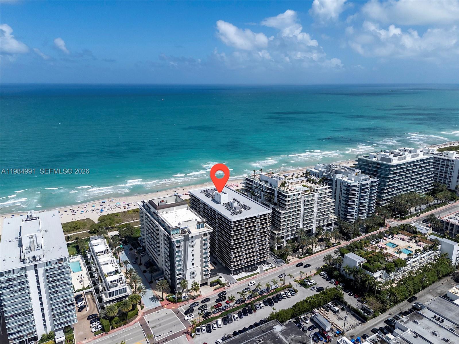 An aerial view shows a multi-story beachfront building marked with a red location pin — 9455 Collins Ave # 409, Surfside FL 33154, SURFSIDE, FL
