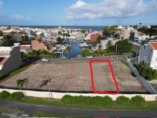 An aerial view shows a vacant, rectangular plot of land outlined in red near water — HARBOUR DRIVE PALMAS DEL MAR HARBOUR UNIT 12, HUMACAO, PUERTO RICO, PR