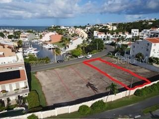 An aerial view shows a vacant, rectangular lot outlined in red near a coastal marina — HARBOUR DRIVE PALMAS DEL MAR HARBOUR UNIT 12, HUMACAO, PUERTO RICO, PR