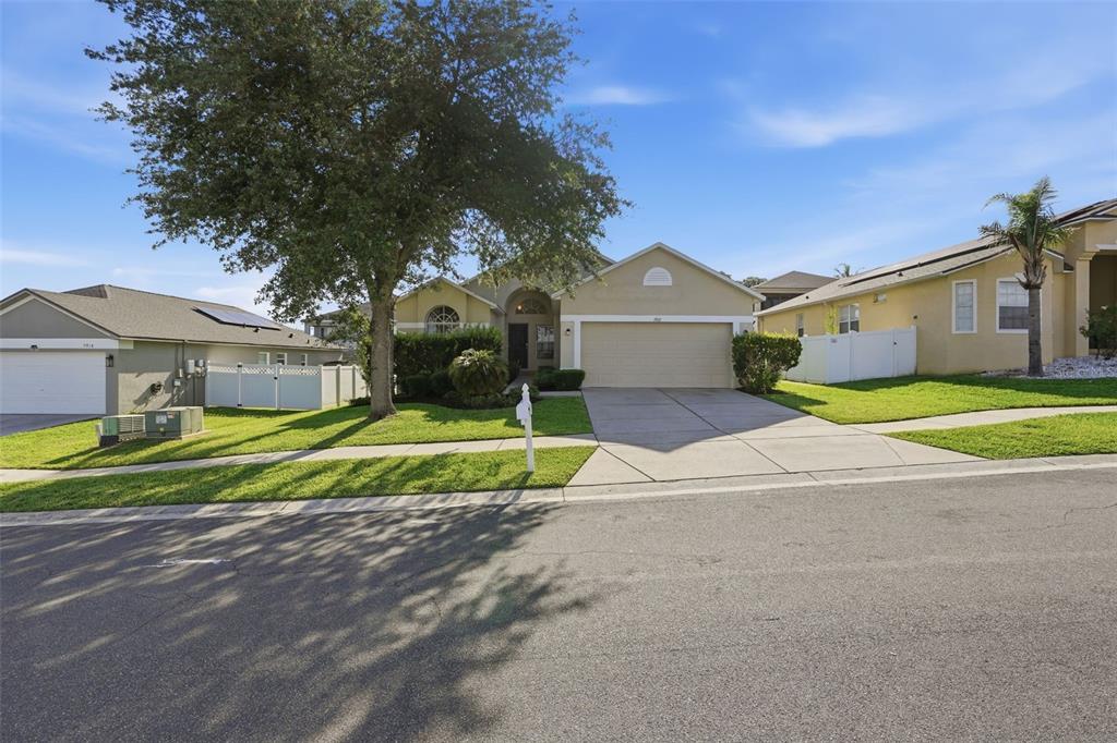 A child's bedroom features a twin bed, a small table with chairs, and a closet — 7912 MERCHANTVILLE CIRCLE, ZEPHYRHILLS, FL