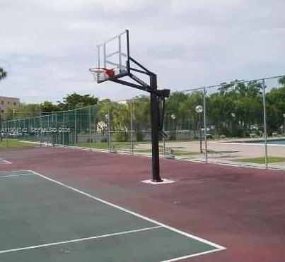 An outdoor basketball court features a hoop and backboard set against a chain-link fence — 8760 SW 133rd Ave Rd # 318, Miami FL 33183, MIAMI, FL
