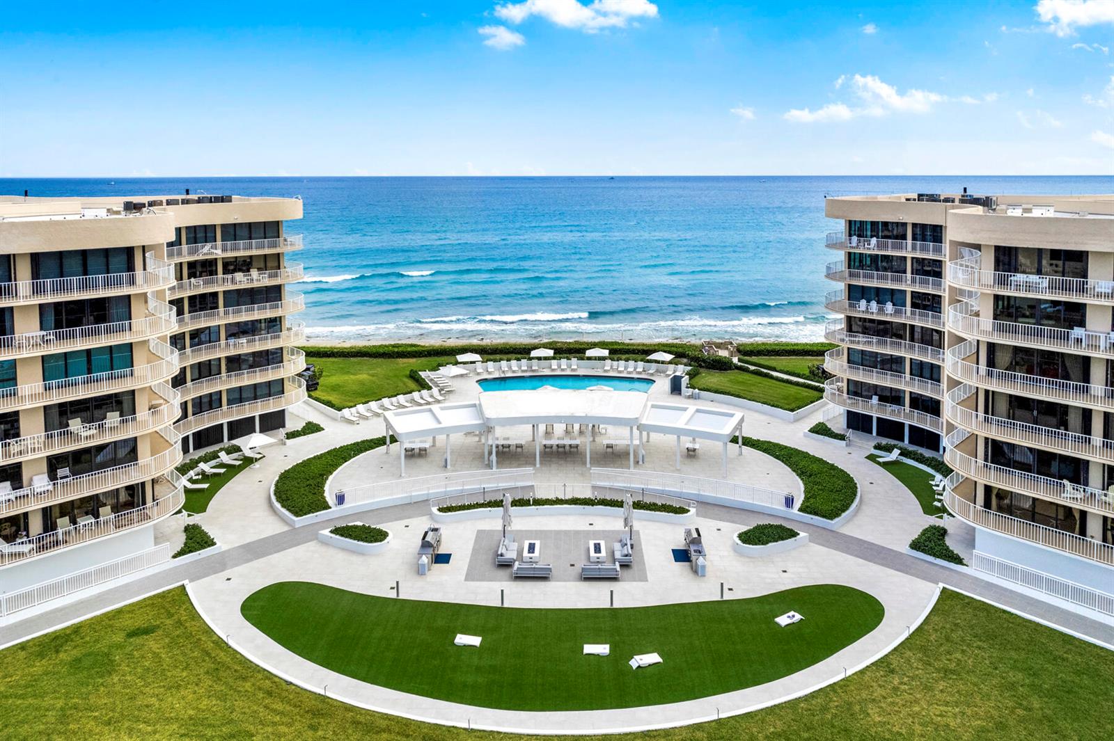 An aerial view shows two curved apartment buildings flanking a central courtyard with a fountain — 3400 S Ocean Boulevard, Palm Beach FL 33480, PALM BEACH, FL