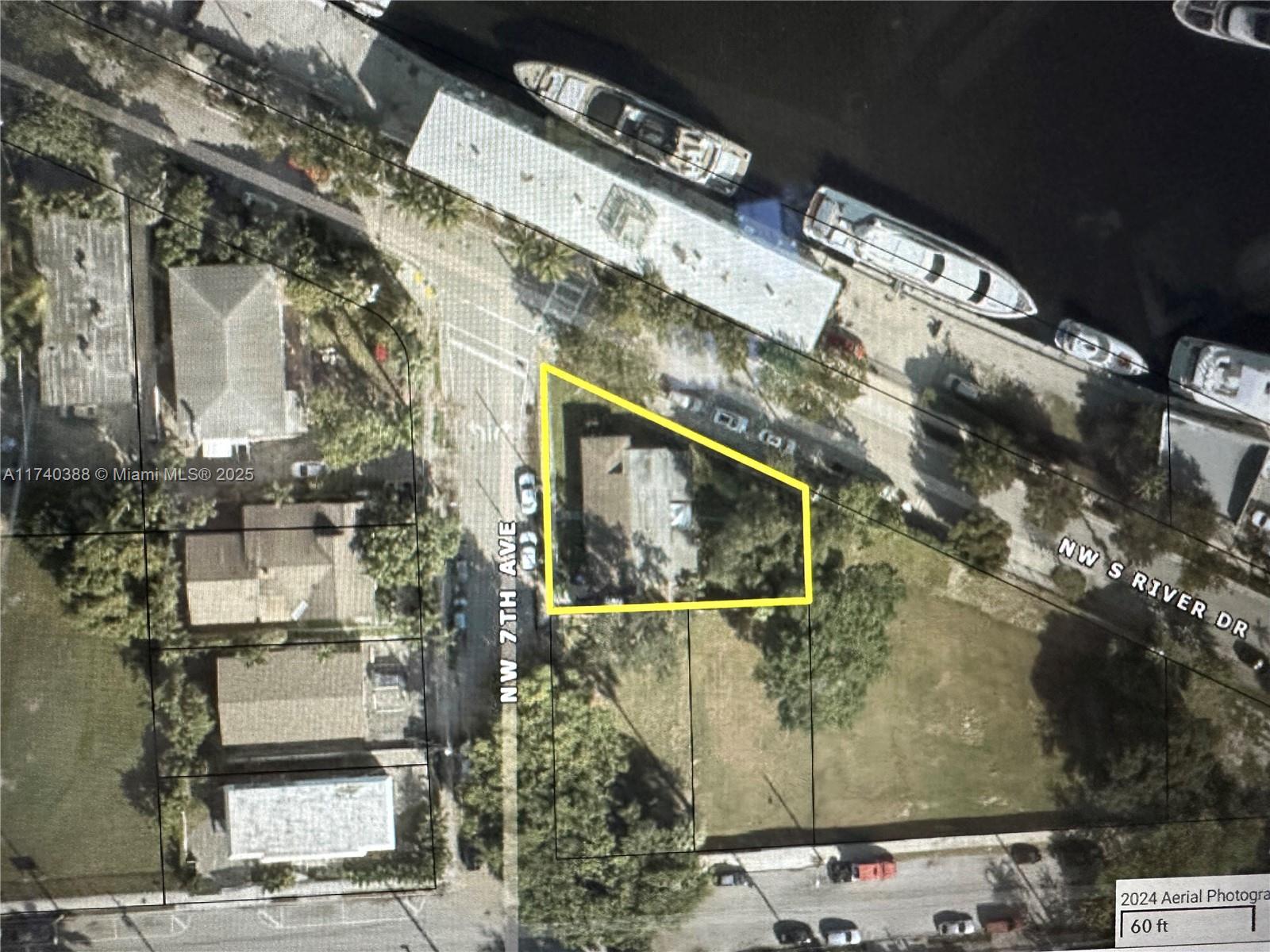 This aerial map shows a residential property lot outlined in yellow along a street — 325 NW 7th Ave, Miami FL 33128, MIAMI, FL