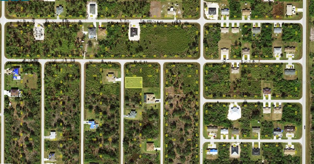 This is an aerial map view of a residential neighborhood with a highlighted vacant lot — 6152 EMMONSDALE STREET, PORT CHARLOTTE, FL