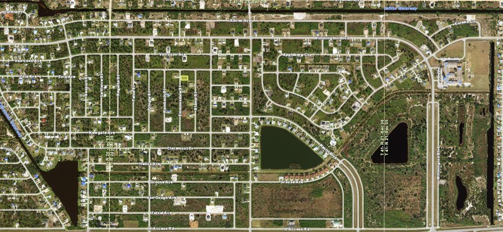 This is an aerial map view of a residential neighborhood with a highlighted vacant lot — 6152 EMMONSDALE STREET, PORT CHARLOTTE, FL