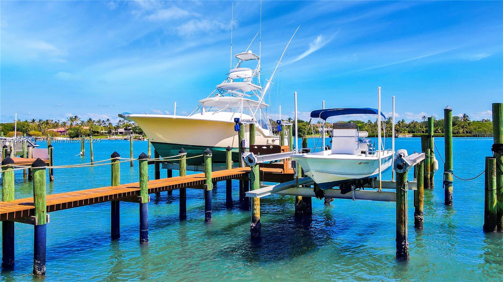 A large yacht and a smaller boat are docked at a wooden pier — 17581 SE Conch Bar Ave, Jupiter FL 33469, JUPITER, FL