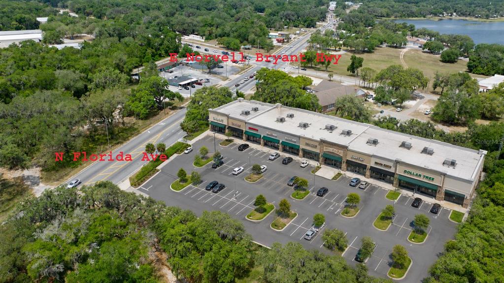 An aerial view shows a commercial shopping center with a parking lot near two roads — 2355 N FLORIDA AVENUE, HERNANDO, FL